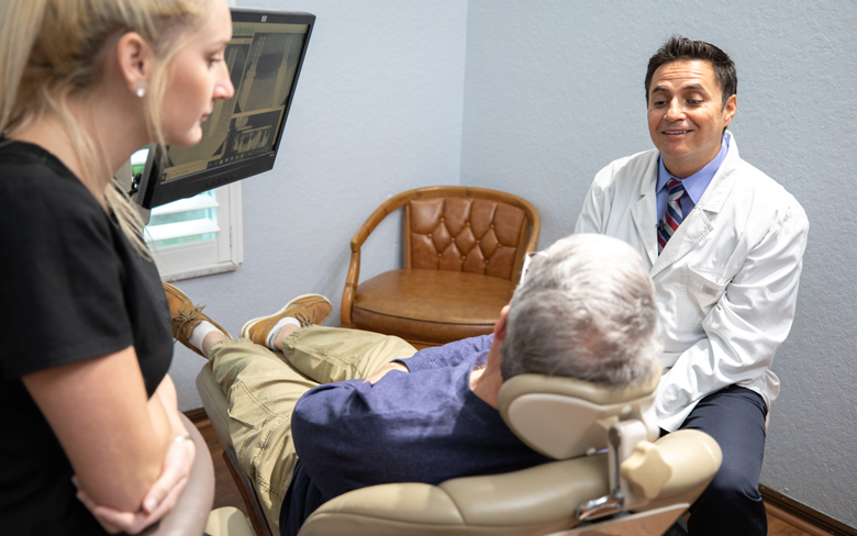 dr martinez discussing full arch dental implants Cape Coral FL