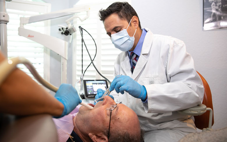 dr martinez performing dental laser procedure Cape Coral FL